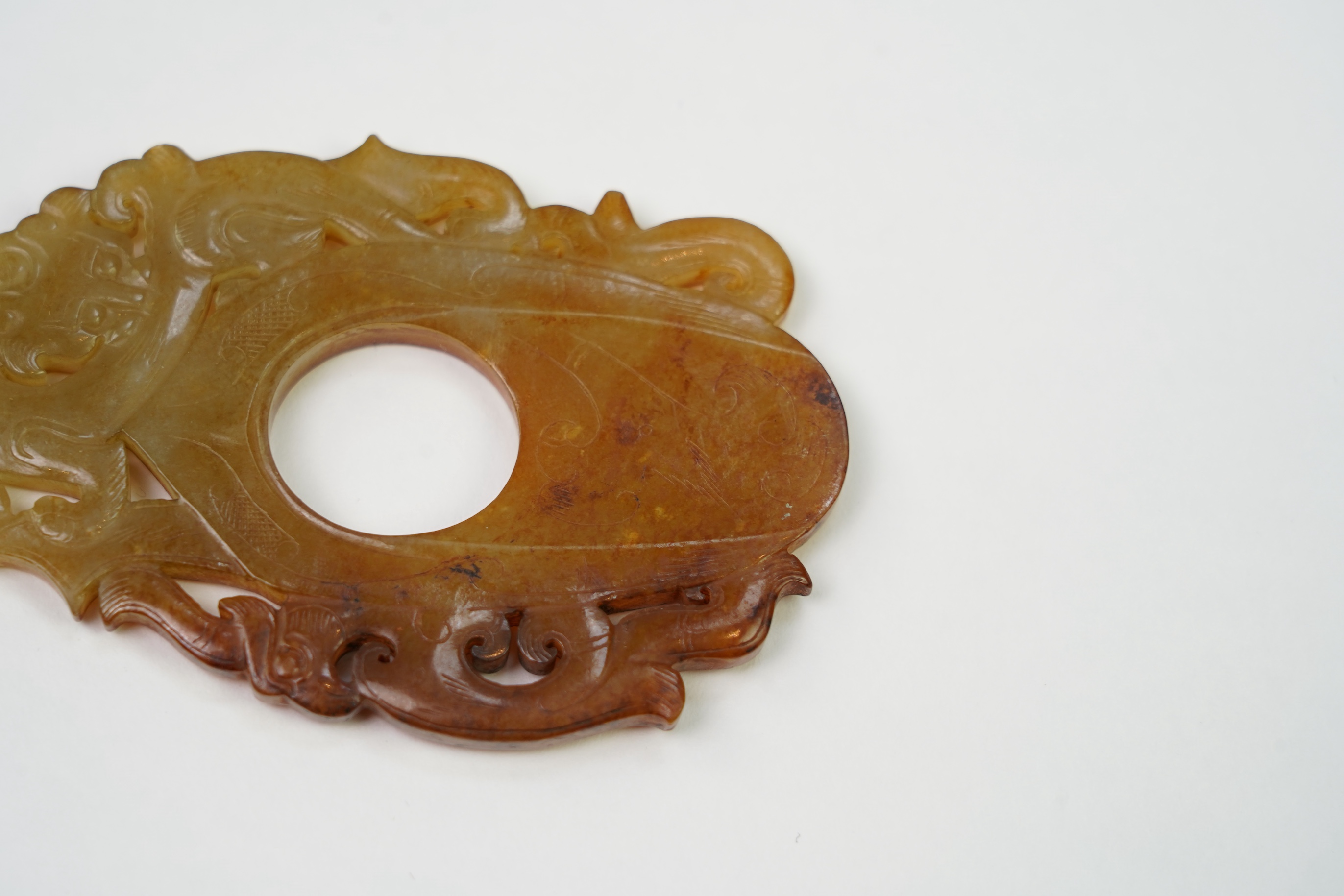 A Chinese archaistic jade plectrum-shaped plaque